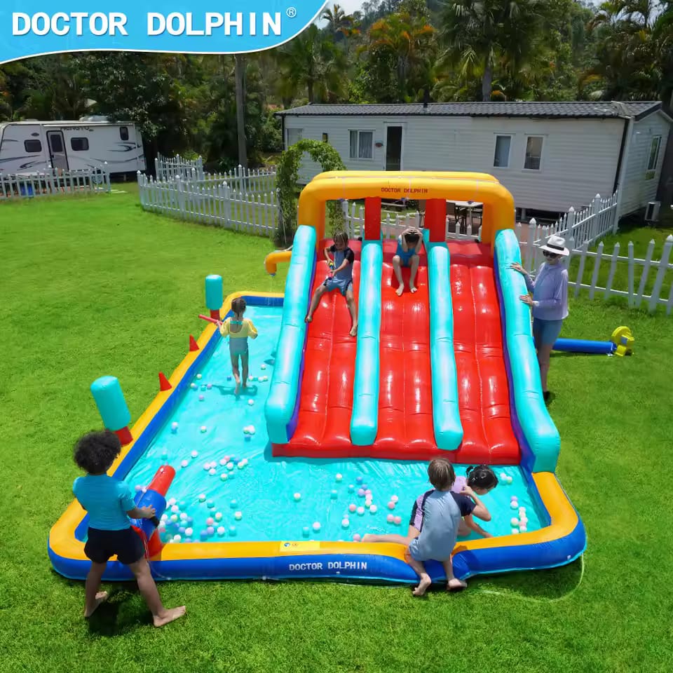 Children playing on an inflatable water slide and pool set in a backyard with 'Doctor Dolphin' branding.