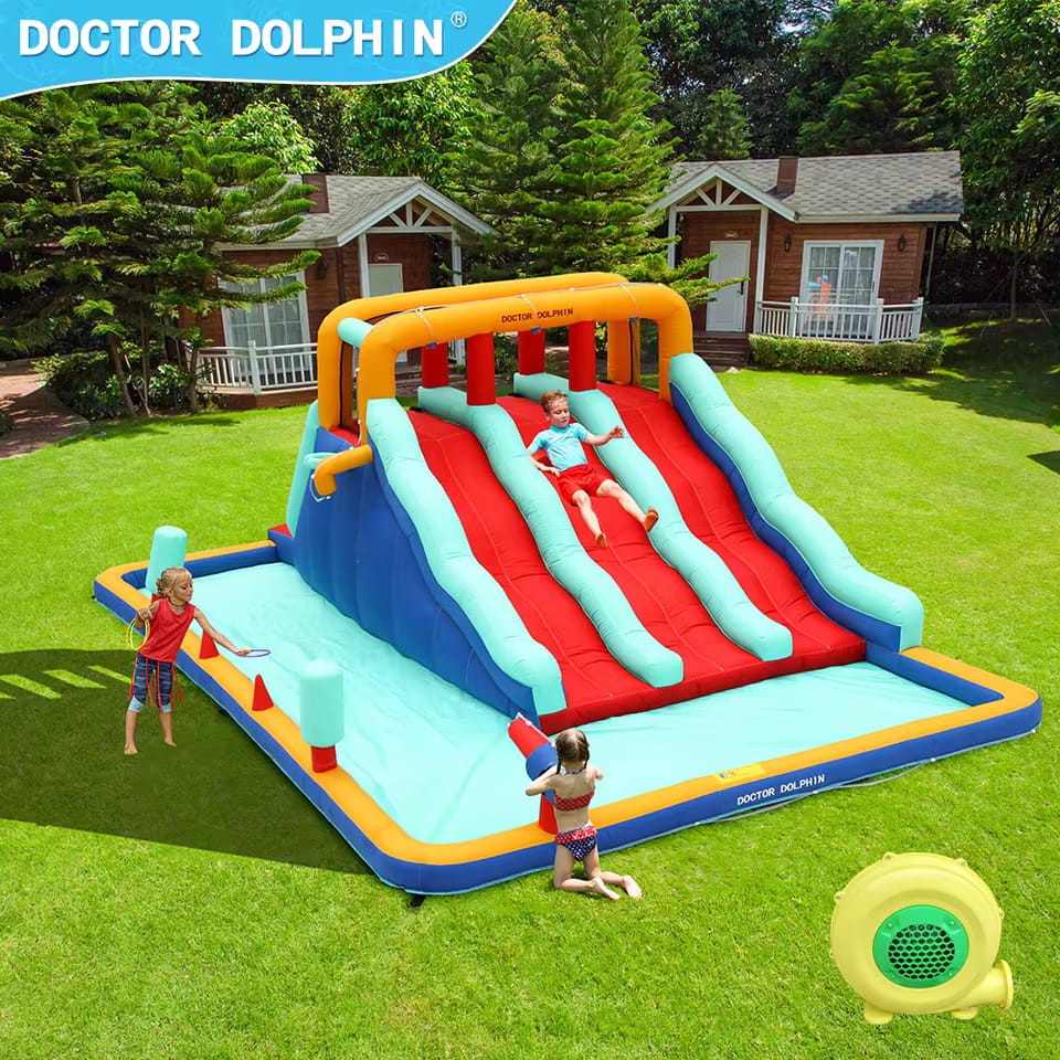 Inflatable water slide with children playing in a backyard setting, featuring 'Doctor Dolphin' branding.